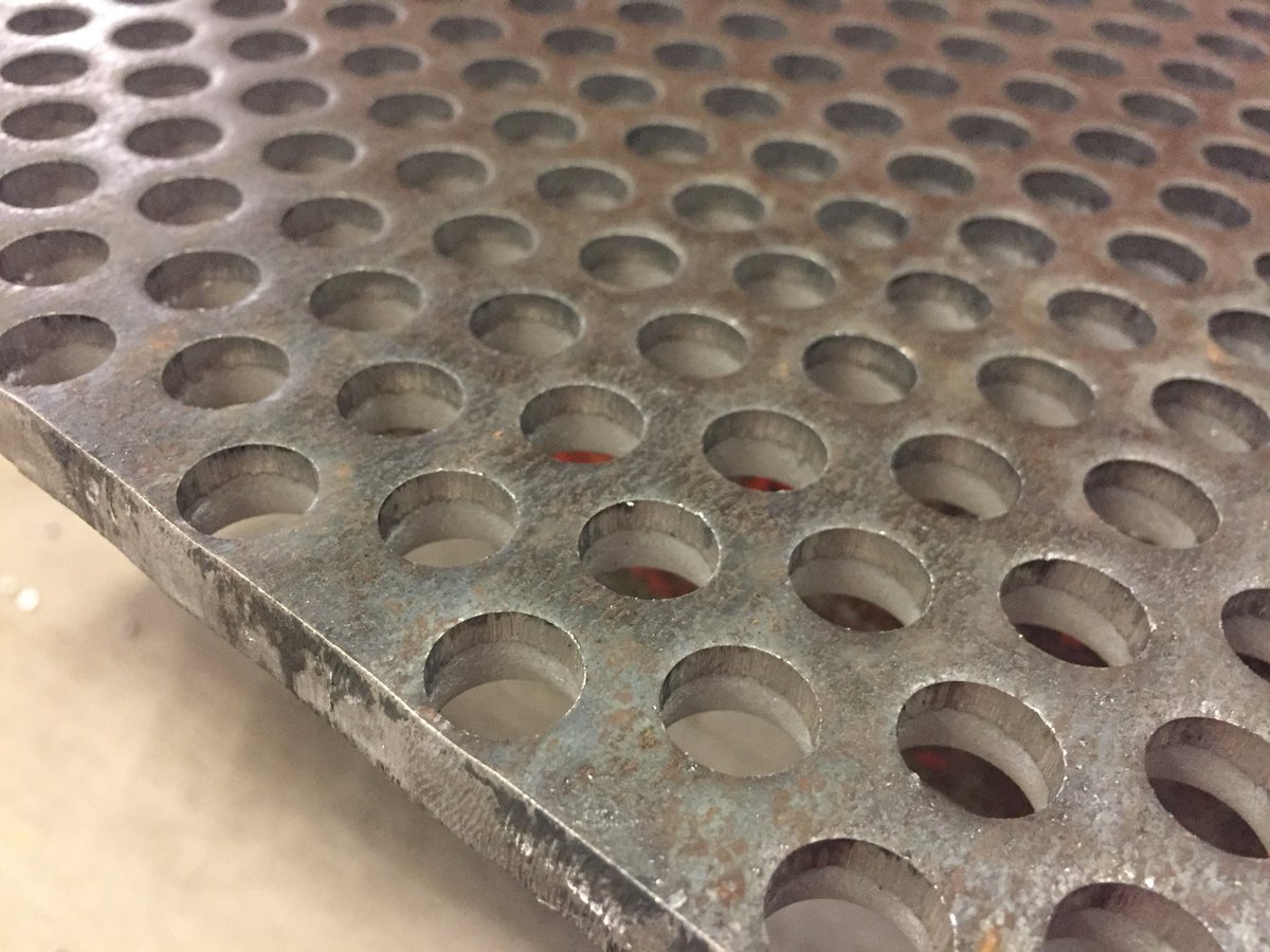After numerous tests and people telling us it was not possible, we have managed to perforate holes in 10mm thick mild steel on our <a href="/AmadaUKLTD/">Amada UK</a> punch press! This is a sample industrial screen with 12mm diameter holes #UKMFG #EngineeringUK #madeinsheffield