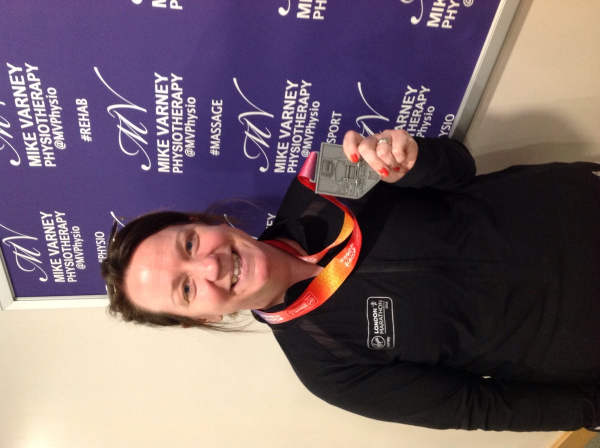 Varneygreenphys's tweet photo. The amazing Tracie has completed her first marathon and bought her medal in to show us. We're so proud of Tracie and all of our patients for running! Well done! #mvphysio #londonmarathon #marathon #physiotherapy #massage https://t.co/QBFKT8aESo