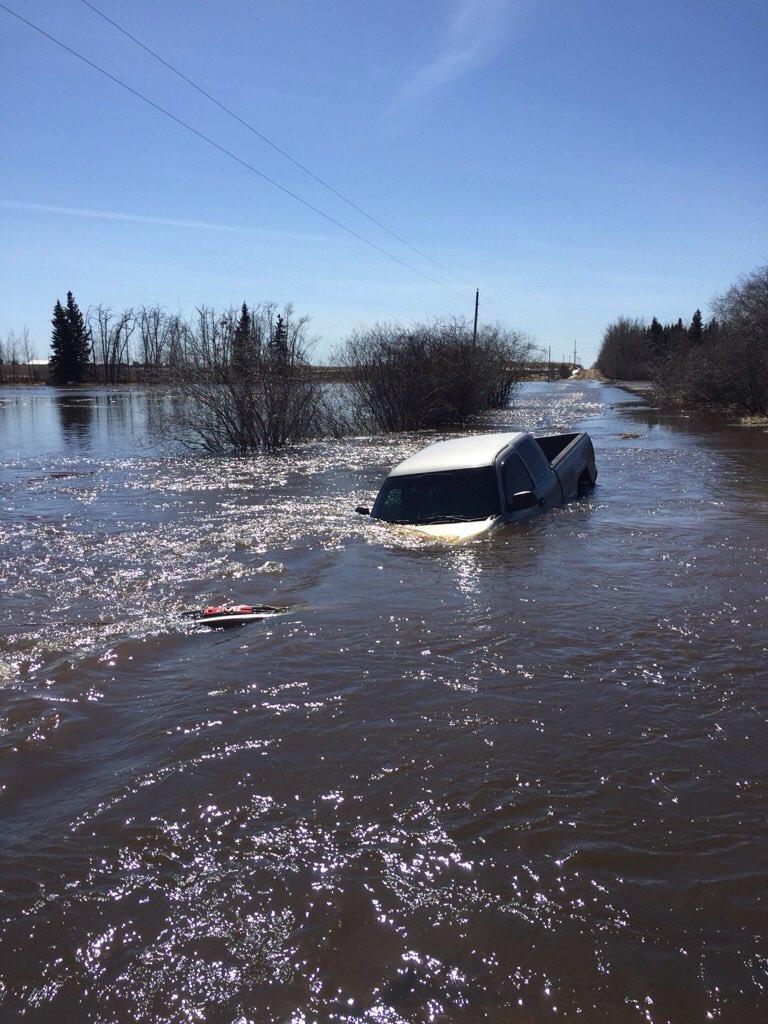 Poor truck....flooding near Star, Alberta.  Don't drive through water....listen to the warnings.