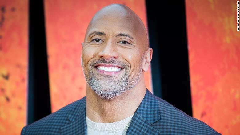 CNN's tweet photo. Dwayne Johnson is now a doting dad of three girls https://t.co/Efjw8yK1zW https://t.co/xYuygpOomm