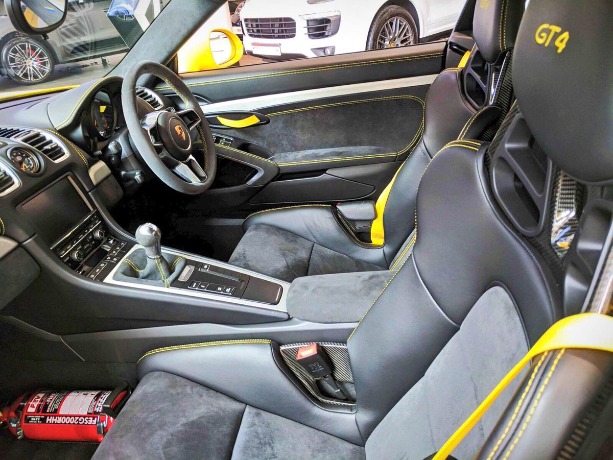 A very Yellow #PorscheMayfair today #RacingYellow #CaymanGT4 #718Boxster