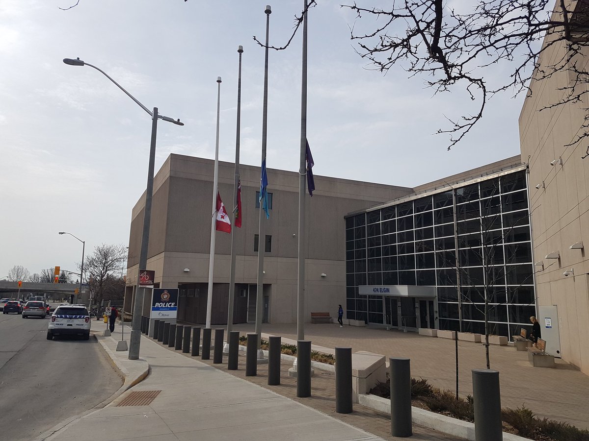 OPSbikes's tweet photo. Flags at half mast in #ottcity @OttawaPolice in respect to Toronto's #senselessloss yesterday.  #TorontoStrong https://t.co/lmGGxXbK9j