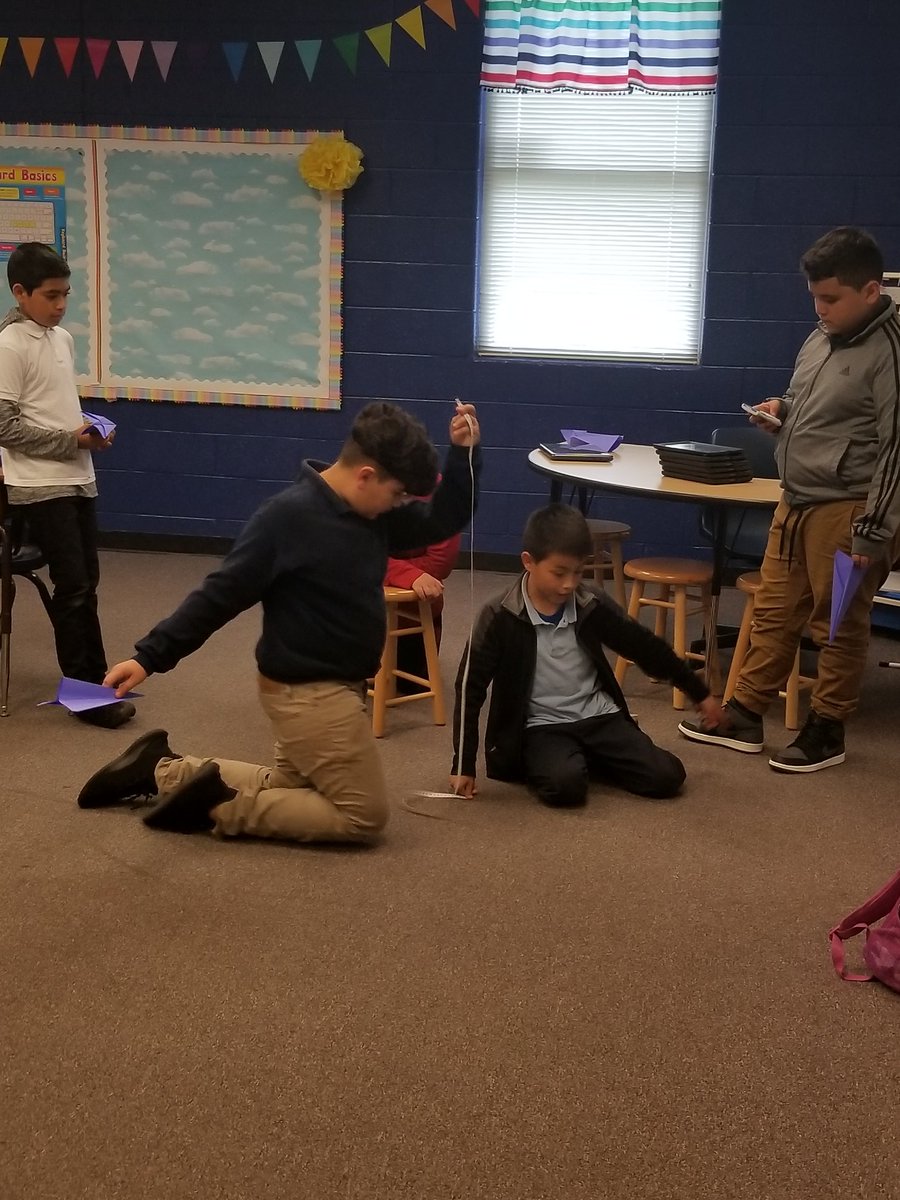 SBSullivan9's tweet image. Today in 5th: we made our BEST paper airplanes, flew them (safely) across the room, and measured the distance in inches and centimeters.  Then, we converted that to feet &amp;amp; meters. #mathisfun #mathmovement