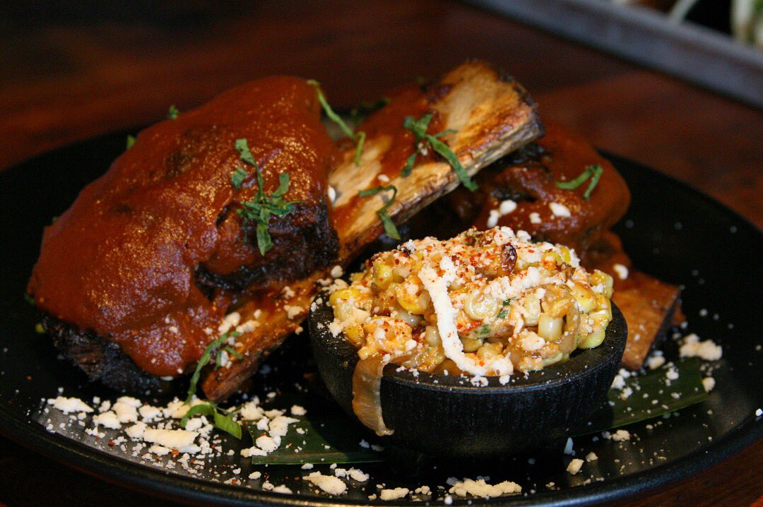 BodegaTacoBar's tweet photo. Brace yourselves because this dish is out of this world. Costillas de Res Enchilada; Short ribs, 3 chili sauce, tajin, queso fresco, grilled corn esquites. https://t.co/Fb46qvMfBs