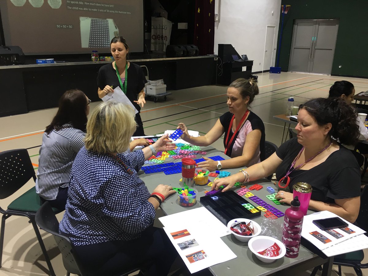 JBS primary staff working with colleagues from Raha school Abu Dhabi using Numicon to help with number problem solving