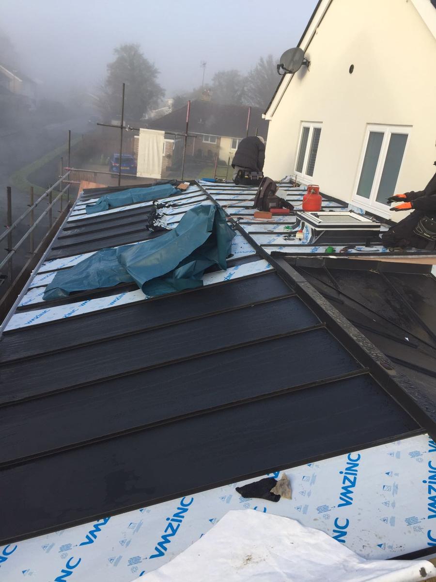 Client: Private / Residential 
Material: VM Anthra 
At Manor Road we installed approx. 70m2 of rational standing seam panels. This project was particularly interesting to install due to the numerous roof lights, hips, ridges and steps in such a small area.