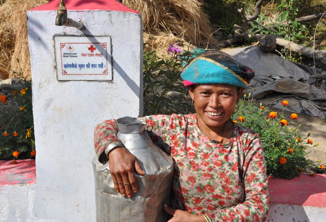 RedCross's tweet photo. Meet Nima. She's collecting water from a tap that is part of a system constructed with support from the #RedCross.

We're still in Nepal, 3 years after a devastating earthquake struck, helping communities like Nima's recover. https://t.co/hx2N9xJ5vQ https://t.co/6IUMsyaOGB