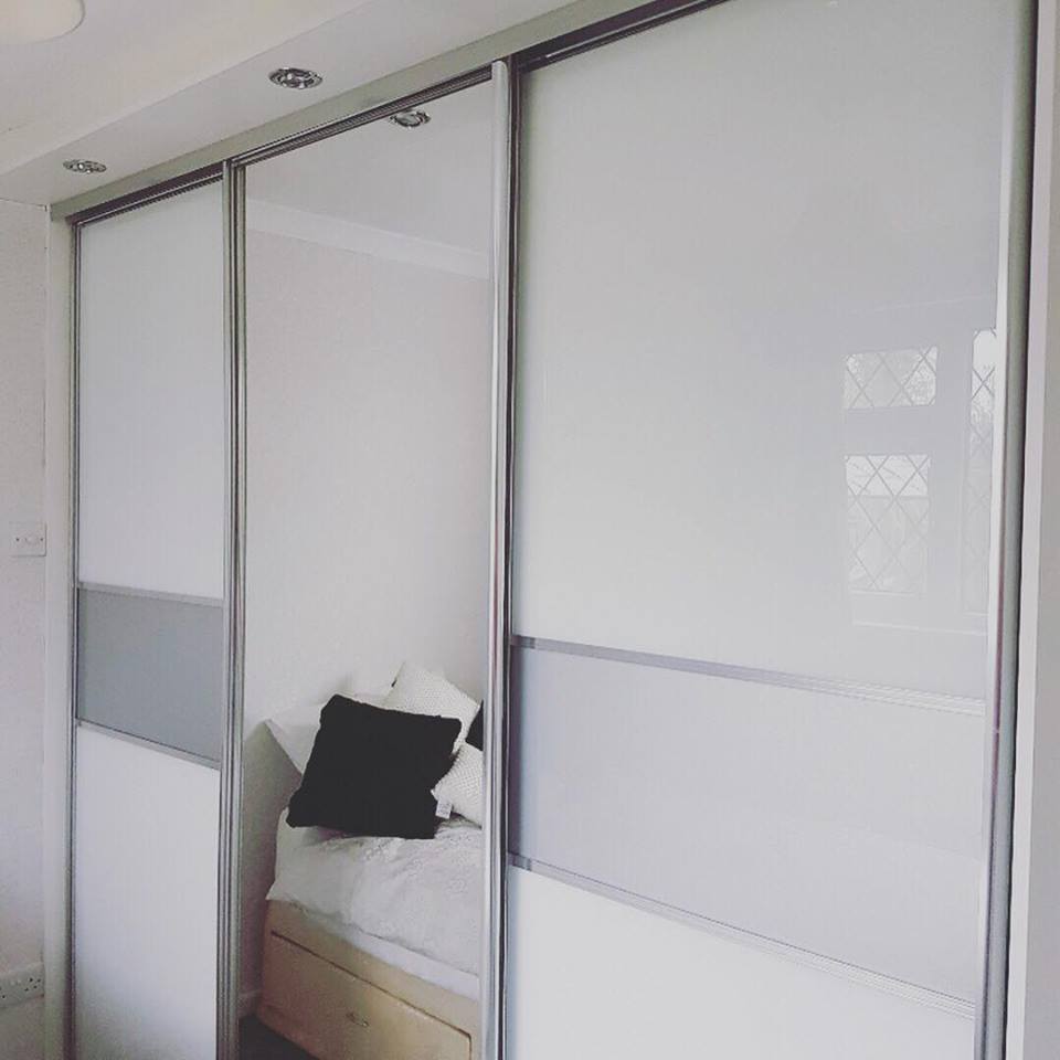 Amodern look with Pure White glass and bottom and grey band in the middle, canopy with dimmable LED lights #slidingwardrobes #showroom #wilmslow #alderlyedge #bespoke #joinery #carpentry #handmade #bedroomenvy #bedroominspo #storagesolutions