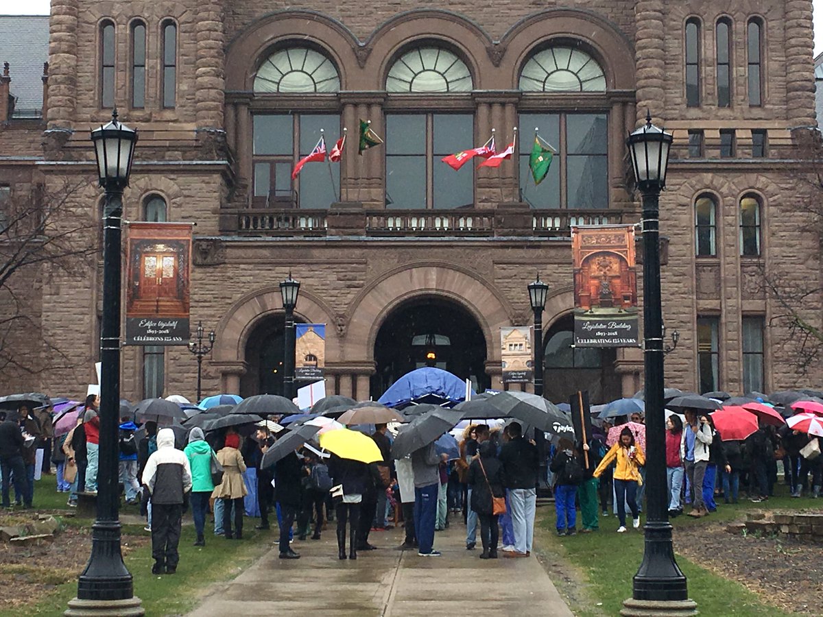 Under these umbrellas, a couple hundred medical students and doctors demanding more residency spots <a href="/Spots4Docs/">Spots4Docs</a> #onpoli