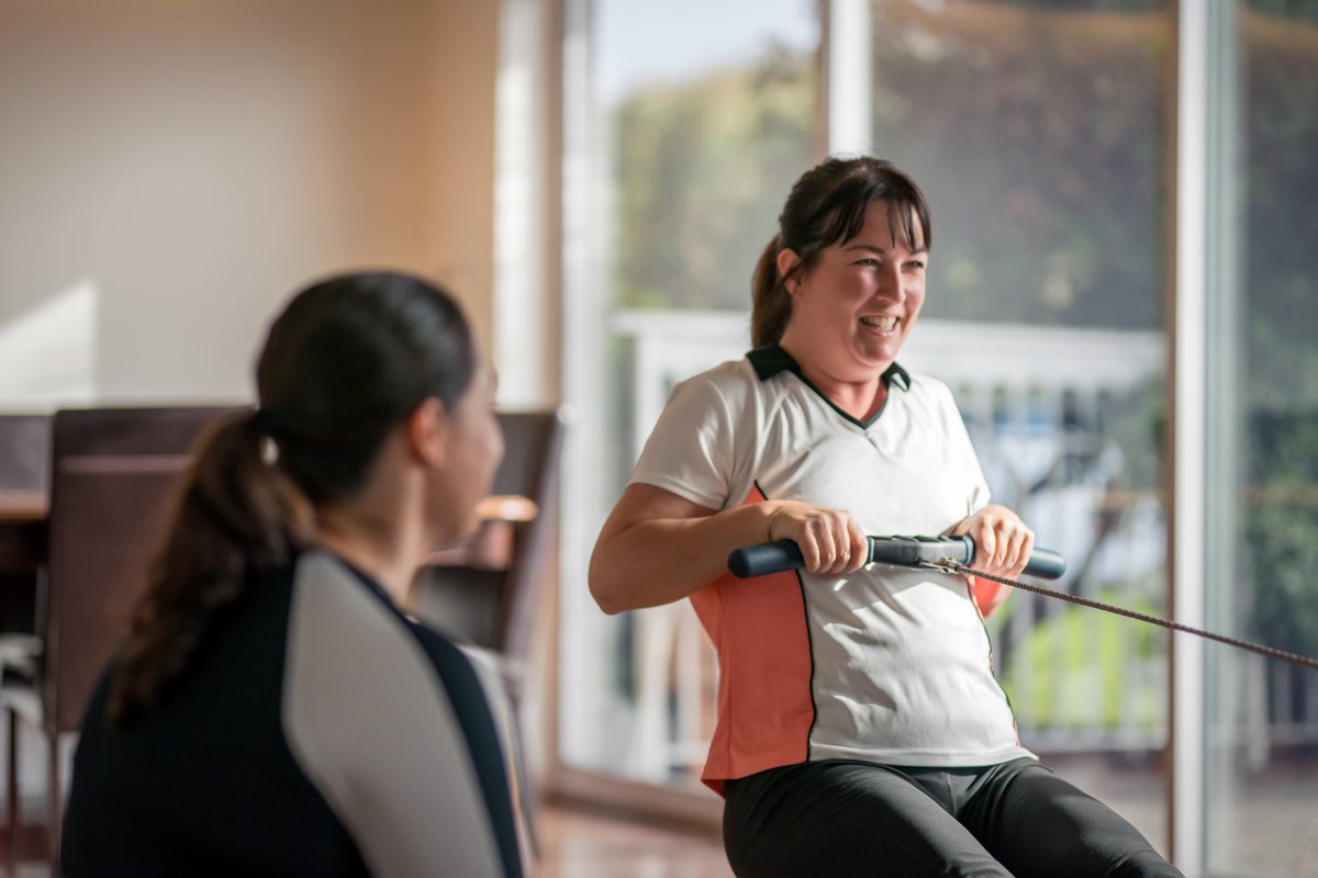 Mind Set Go participant Debbie Lee Evans works out on a rowing machine beside Canadian Paralympian, Victoria Nola.