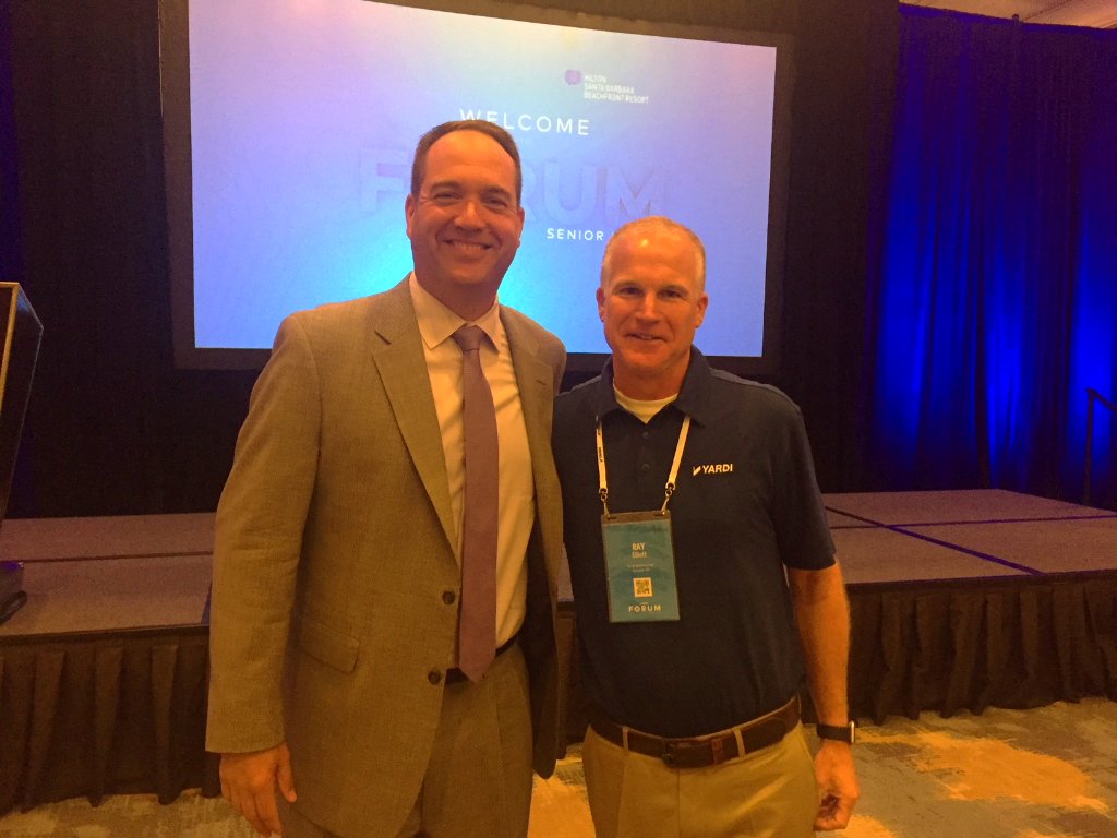 Yardi's tweet photo. James Balda, @argentum President & CEO, kicked off today's #YardiForum in Santa Barbara. “We are going to need to use technology as a means to become more productive and more efficient." He discusses technology & current challenges facing #seniorliving: https://t.co/WCqqG5XjhG https://t.co/Bm3kAXmwRJ