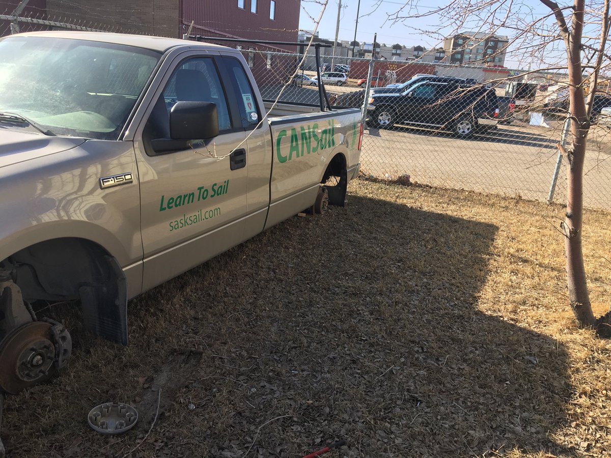 GolfSK's tweet photo. Once again our building was hit by an “outstanding citizen” who did leave his jack behind. 

On Friday, 12:00 am, a male driving a white/grey Chev pickup stole the rims/tires off the CANSail truck. 

@SaskatoonPolice @ctvsaskatoon @GlobalSaskatoon https://t.co/m21jayVhZR
