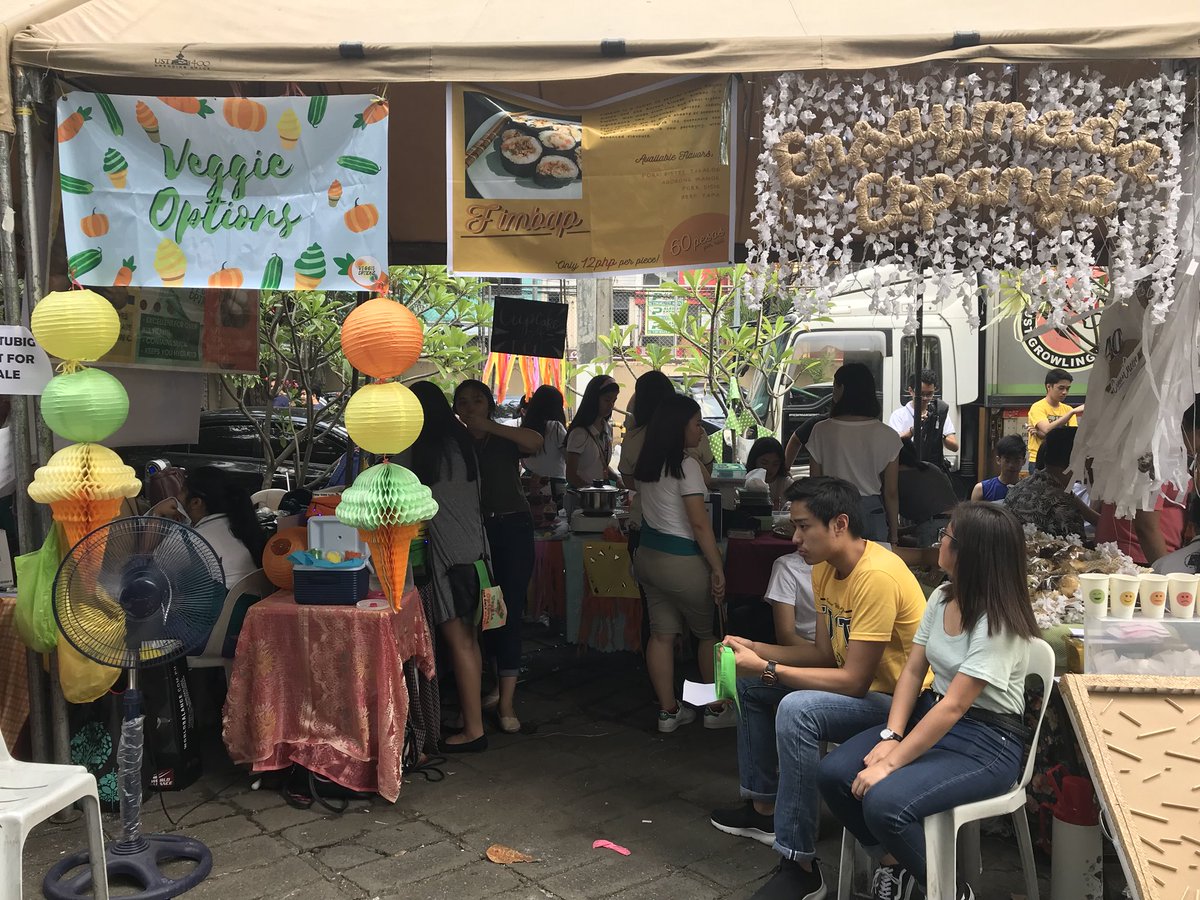 FlMBAP's tweet photo. Our booth is now open!! Come thru! 🧡 We’re here at the UST TYK Parking Lot until 5pm! 😉 #F1MBAP https://t.co/LhnhwlC6YY
