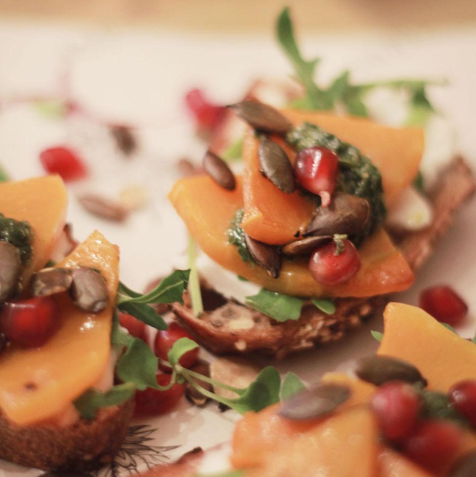 Squash crostini with cream cheese, rocket, toasted pumpkin seeds, pomegranate &amp; lime sesame pesto. It's fresh and full of flavour so make sure to add it to you to try tapas list 😉