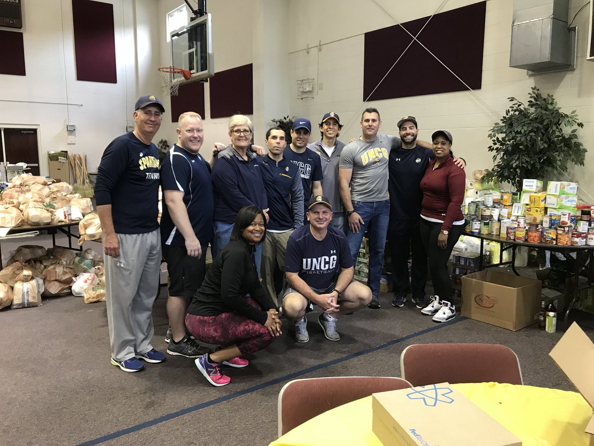 uncgspartans's tweet photo. It’s our 5th Annual UNCG Big Help Day!
Our coaches and staff are volunteering at @greensborocity Storm Recovery preparing bags of food and supplies for storm victims. #UNCGBigHelp #letsgoG https://t.co/Ux6rl73YHi
