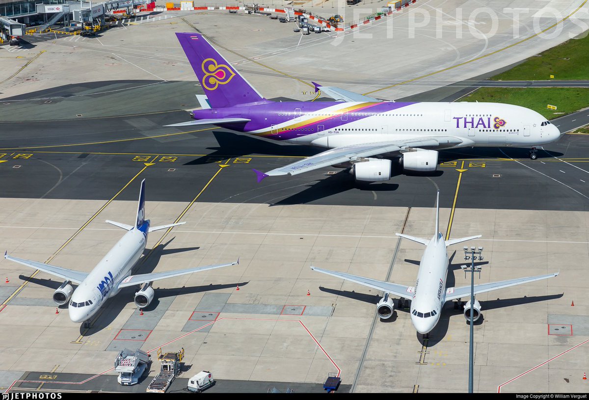 A Thai Airways A380 taxis past a pair of smaller cousins in Paris. jetphotos.com/photo/8931024 © William Verguet