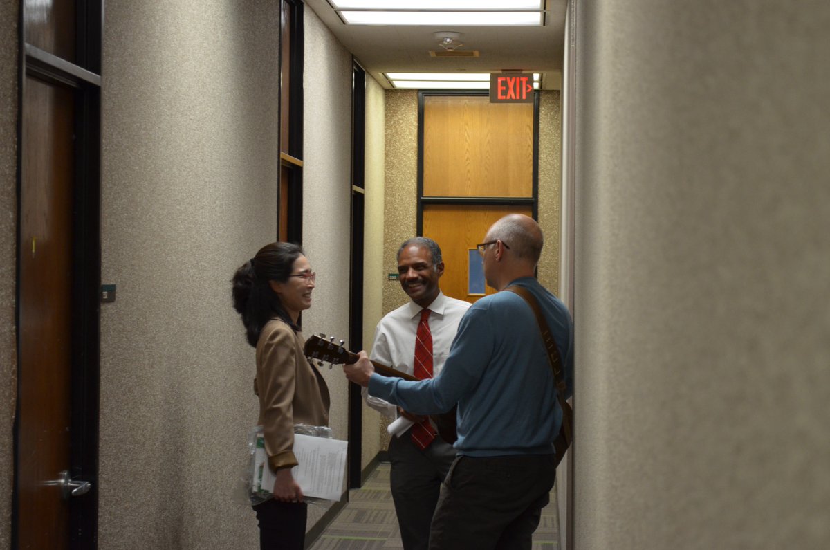 UNTEcon's tweet photo. @UNTEcon enjoying some music during a few moments of downtime.  Here's Dr. Jeff Rous wandering the halls of the Econ Dept., strumming and singing, enticing faculty members Jiyoung Kwon and Harry Ellis out of their offices.  Good times! 🙂🎸🎶
#UNT #acadowntime #coolteachers https://t.co/ahYbxvttHo