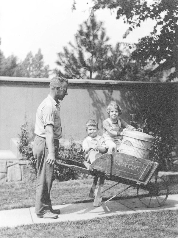 #ThrowbackThursday Mr. Sprague, the Martin's gardner, working and playing with the Foster children in Graycliff's courtyard! Photo: UB Archives #BuffaloHistory #TBT #gardening