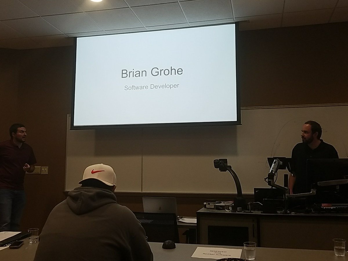 WNECSIT's tweet photo. The ACM Club's Networking Event is underway! Brian Grohe and Kevin Brown (two 2017 grads) are talking about their work at @RedikerSoftware https://t.co/0LxHNbiy8w