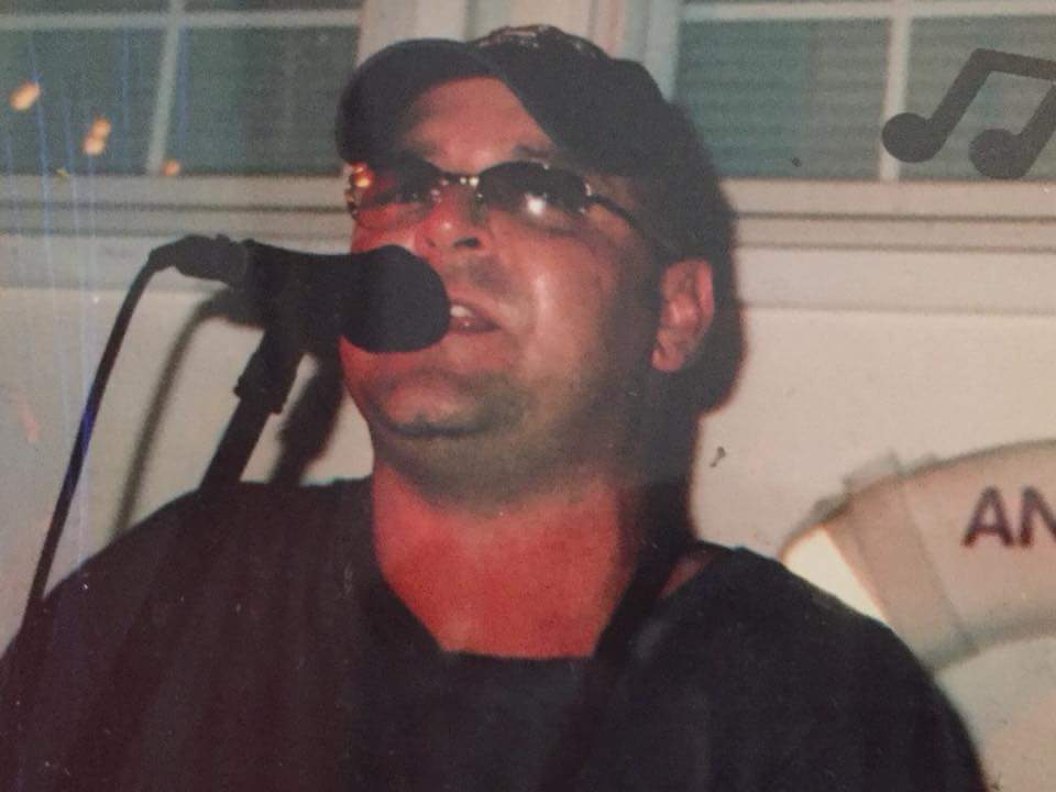 Capt Dan playing music on the patio tonight.