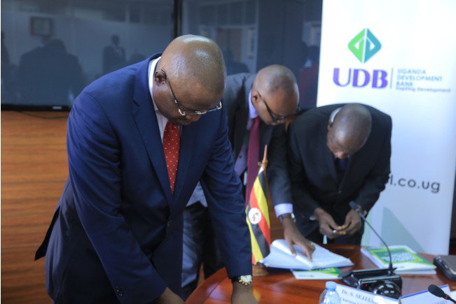 udbltd's tweet photo. Hon. Matia Kasaija, Minister of Finance, Planning and Economic Development takes a close look at our 2017 Annual Report. https://t.co/A8SVSYZZoq