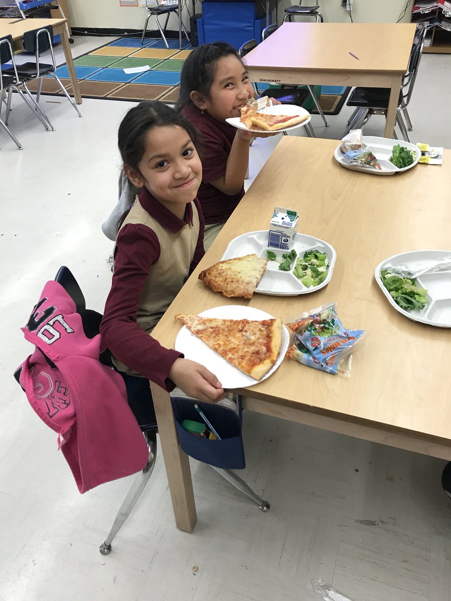 Students enjoying pizza for their PAWS reward lunch! 🍕🍕🐾🐾