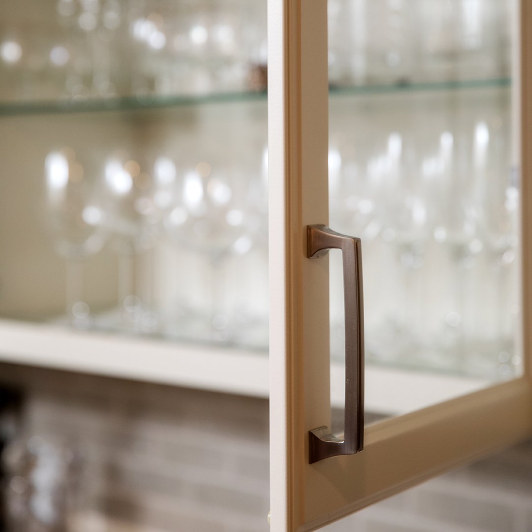We wish our own glassware collection was as organized as this client's. Our #spaceplanning gave her tons of room to show off the #stemware. Photo by Collin Richie. #remodelingideas #greatkitchens #inthemoodfordesign