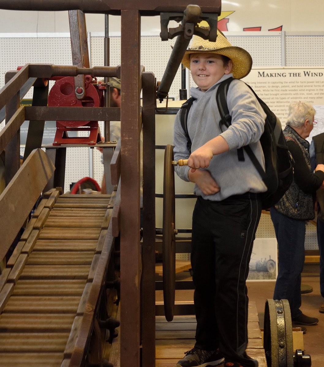 Churning buttermilk is tough, but he makes it look easy at the @LandisValley exhibit @FarmShowComplex . #kidsMW @MuseumWeek