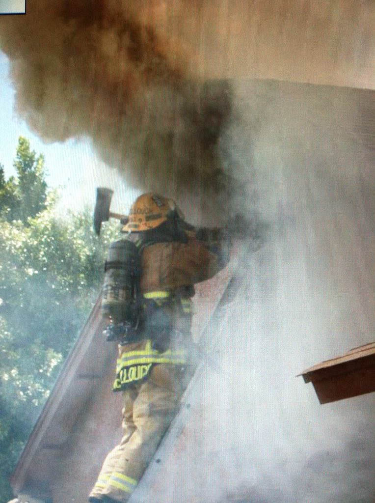 healthyfireguy's tweet photo. The moment just before things get a bit hotter lol. Nothing like putting your face in the flames.  Pop the gable and spray some water!!  Steam burns just a bit.  #savinghomes #savinglives #firefighterfitness #firefighterfun https://t.co/cy7qkjhD58