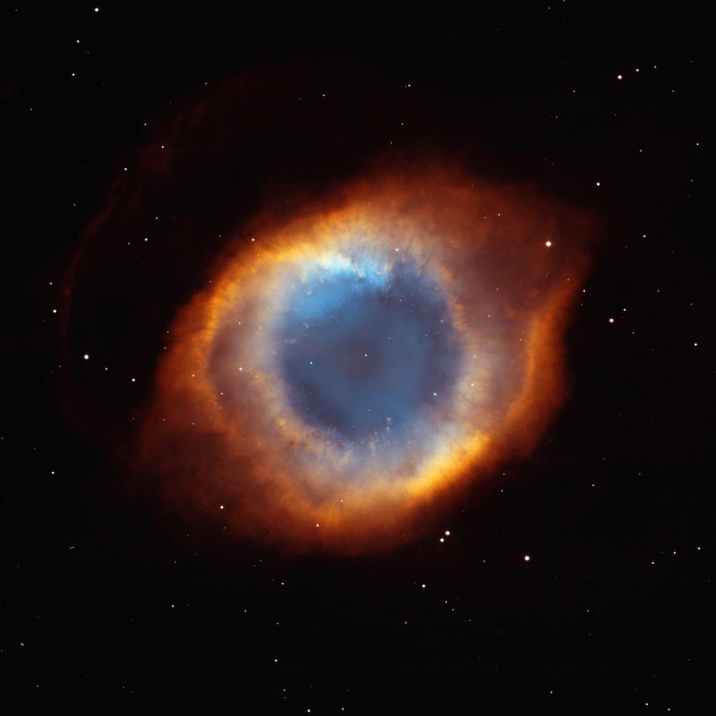 NASA's tweet image. Released 15 years ago this week, this view of the Helix Nebula shows the colorful outer layers shed by a Sun-like star as it was dying, seen by @NASAHubble + Kitt Peak Observatory: go.nasa.gov/2I7QqGa #TBT
