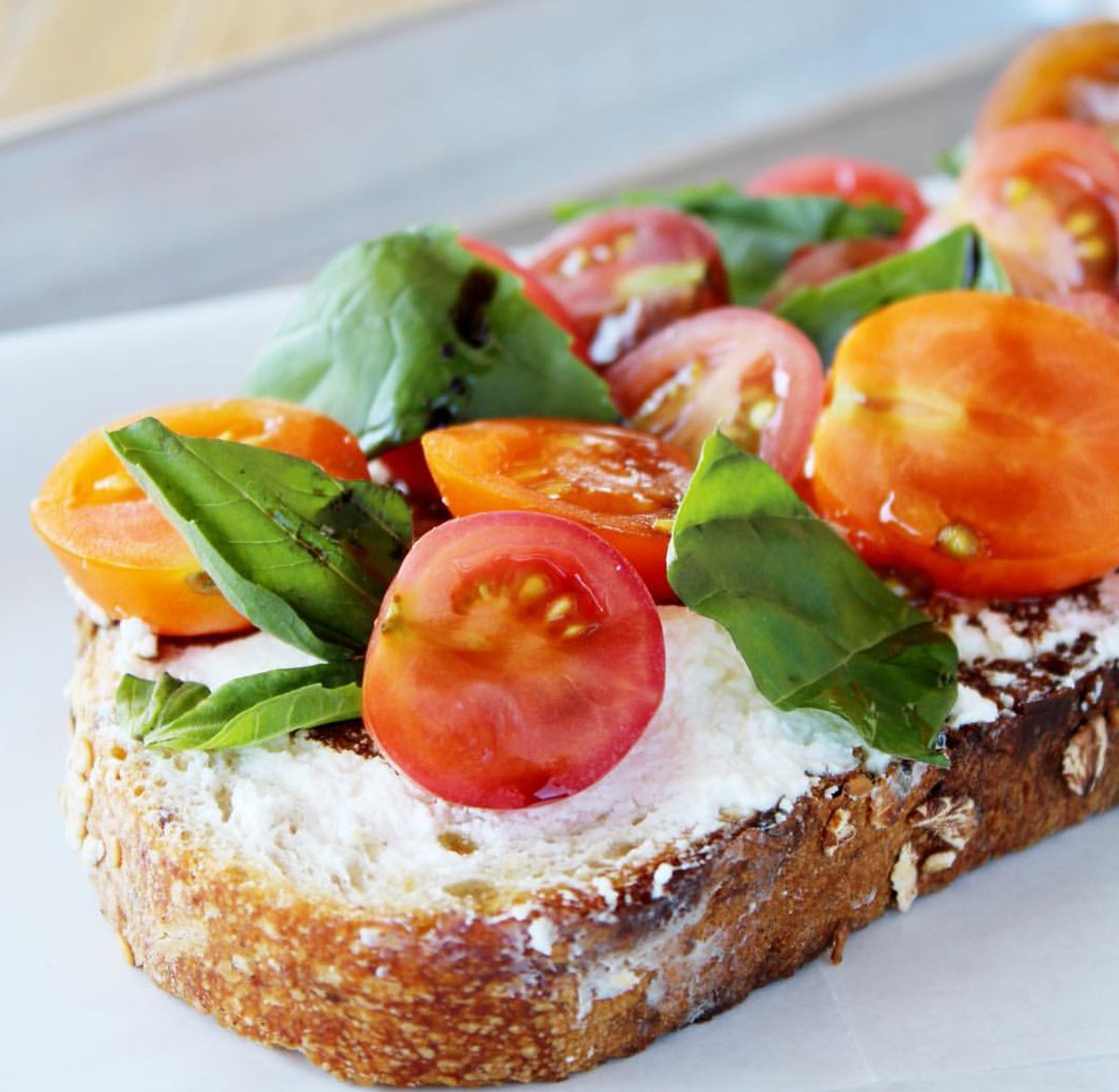 Lunching with one of Dale's Fancy Toasts from Clare's today because when ISN'T anything involving tomatoes, basil, and ricotta the right thing to do?