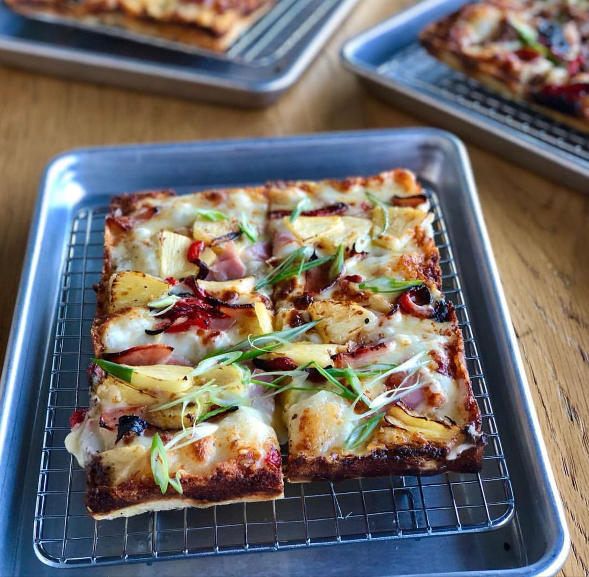 There's a pizza for everyone at The Corner. This one here is The Super Fly - a white pie topped with ham, pickled pineapple (YES!), red bell pepper, and plenty of shaved scallion. Did we mention LUNCH SPECIALS, too? We'll see you 'round the table.