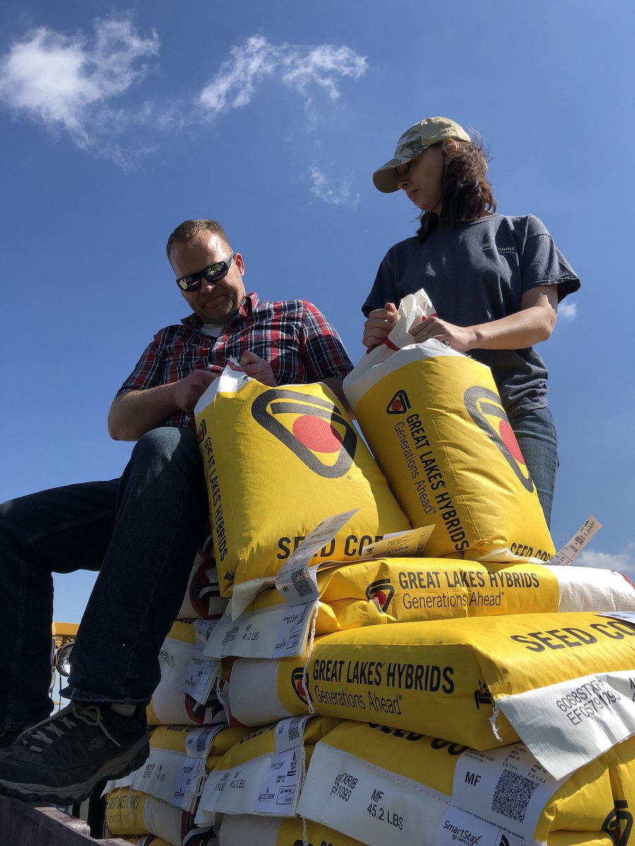 It takes everyone on our farm to get it done. My seedsman and his wife helping dump <a href="/GreatLakesSeed/">Great Lakes Hybrids</a>.