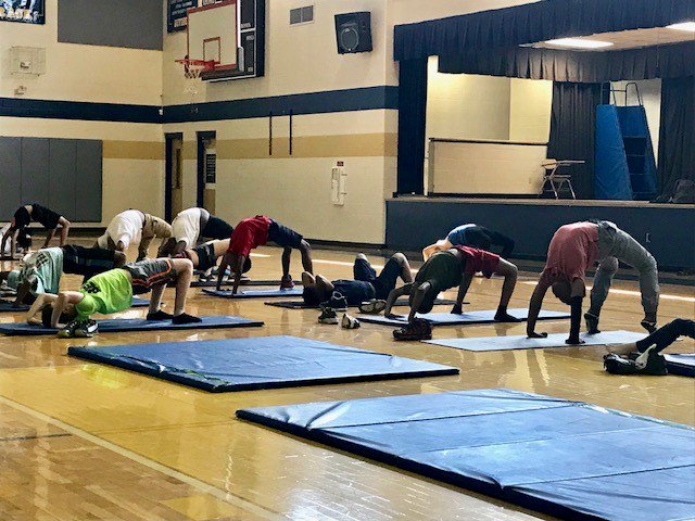 MNPS_kidshealth's tweet photo. Celebrating Thoughtful Thursday @GraMarMiddle with yoga! Students had the chance to learn some yoga poses and its many benefits for your body and mind! Thank you to Emily @YMCAofMiddleTN and @nashhealthorg #MNPSWellnessWeek #ThoughtfulThursday https://t.co/VHIeQ6Cu3R
