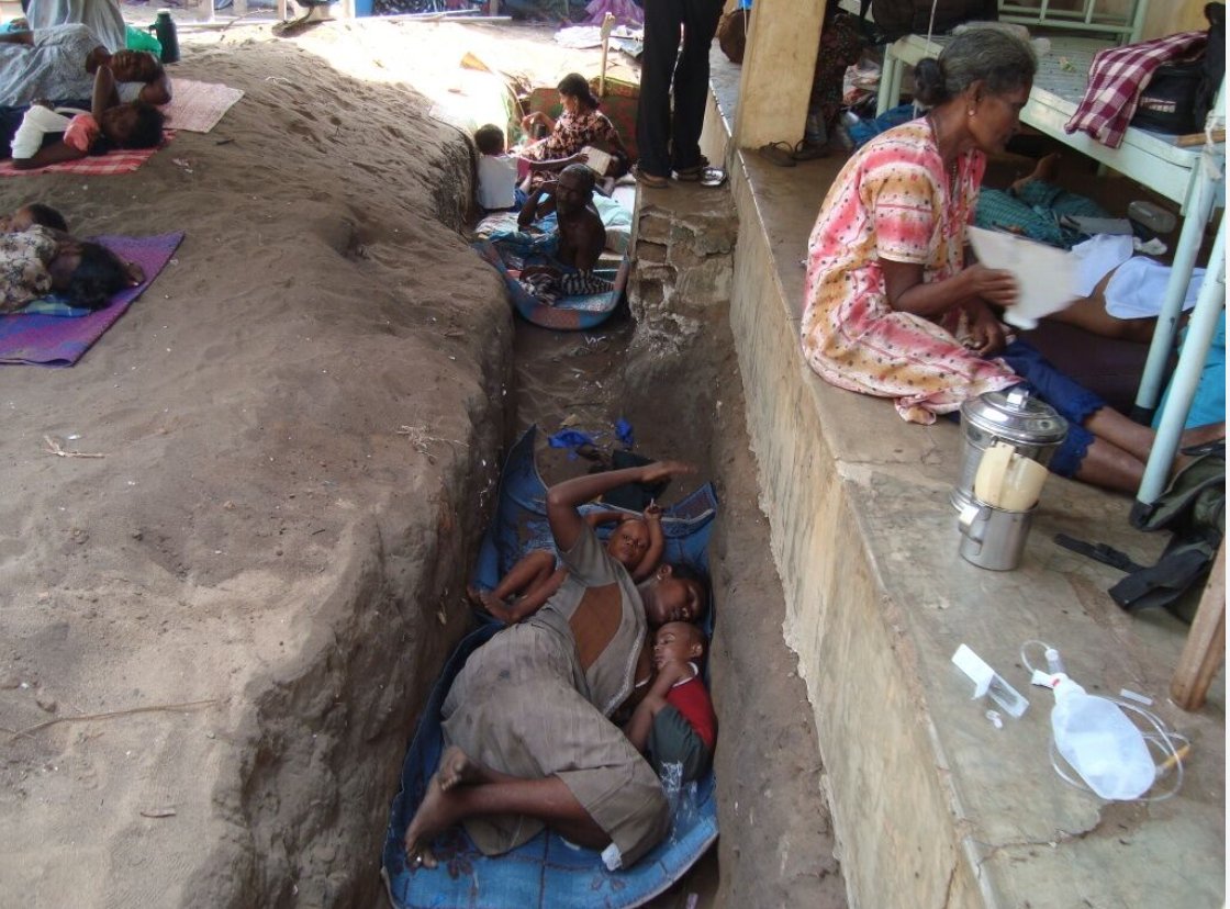 francesharris0n's tweet photo. HRW: at around 8 a.m. on May 12 2009 the makeshift hospital at Mullivaikkal was  shelled-  Nearly 1,000 patients were in the hospital - photo shows patients on 11 May before the attack in which 49 died https://t.co/42xdqHSf7T https://t.co/9lBxqM6zlP