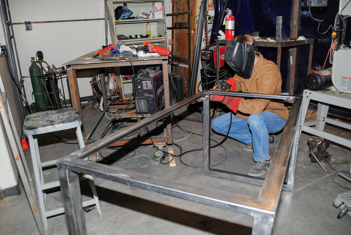BrophyNews's tweet image. Just another day in the art studios of Brophy... Patrick Worley &apos;18 finishes a steel table at the Worley &amp;amp; Murphy Welding Station (w/ James Murphy &apos;18) in a corner of Mr. Marc Kelly&apos;s art studio. #practicalart #create #AMDG