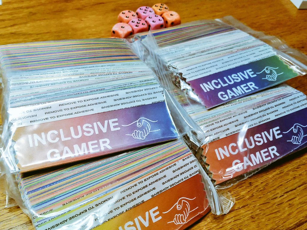 discountcompost's tweet photo. They're here! 2018 #InclusiveGamer ribbons have arrived. Available at most major and some minor game conventions in the US this year. https://t.co/BSpljICCAa