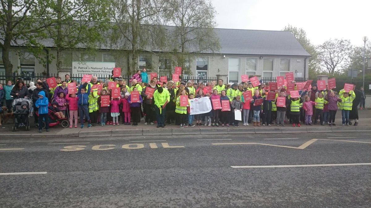 SPDD17's tweet photo. Great turnout at today’s peaceful protest despite the bad weather. The message is loud and clear. Child safety must be prioritised. #Donabate residents will not accept the current unsafe conditions our children face travelling to and from school on a daily basis. #childsafety https://t.co/wf0x7xJrYB