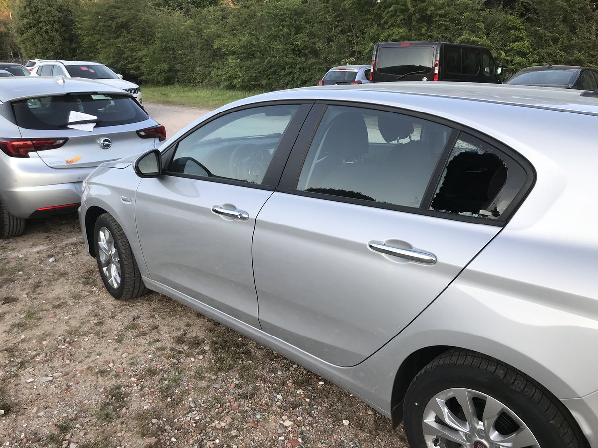 RacingLines's tweet photo. Absolutely unacceptable: numerous cars broken into, windows smashed in allegedly guarded @f1 and media personnel car park #SpainishGP https://t.co/IwZcWuopAn