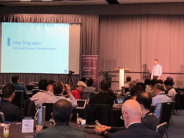 3Nimbus's tweet photo. Chris Falk from @buyatab takes the stage to talk about the Technical Culture Transformation after a Migration to the Cloud #DevSecOpsSummit https://t.co/bNzNMT0aro