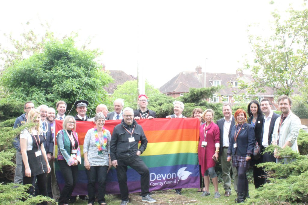 DevonCC's tweet photo. To mark the 10th Exeter Pride, staff, councillors and partner organisations gathered together for the raising of our rainbow flag at County Hall, and tomorrow, will be taking part in the Pride parade! See you there!  @ExeterPride  @DCCLGBT #ExeterPride #WeAreDevon https://t.co/lbn87gPSWV