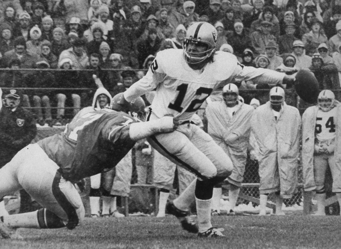 TheKenStabler's tweet photo. Lyle Alzado of the @Broncos gets a hand on Ken Stabler in this 1974 game in Denver. But you can't rattle the Snake. The league MVP would throw 4 TD's in the Mile High snow while defeating their division rivals 28-17. Ken posted an incredible 141.9 QB rating that day. https://t.co/ND4ucpUrHf