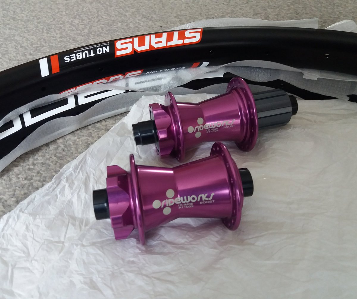 BuildCycleWorks's tweet photo. I had thought Rust Components had bought me some chips wrapped in paper. But when I unwrapped these awesome purple @rideworks hubs and some Stan's Baron rims it was even better. Looking forward to getting these built up. #Buildcycleworks #rustcomponents #rideworks https://t.co/rELgUd0mDf