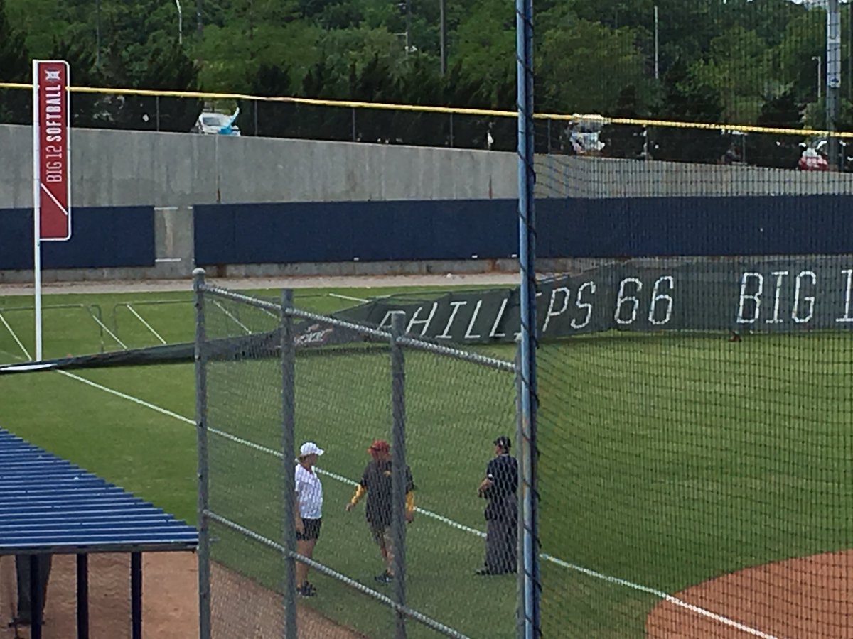 TexasSoftball's tweet photo. The damage out in LF as a few Longhorns went out to try to put it back up only for it to fall again in the high winds... https://t.co/ZoPa6RW7Ye