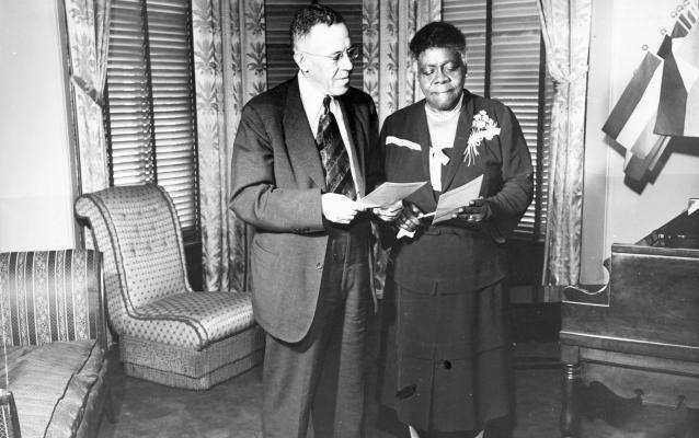 MMBRetreat's tweet photo. Cumberland Willis Posey, Jr., owner of the Homestead Grays Negro League team, with Mrs. Mary McLeod Bethune in the parlor of the headquarters of the NCNW. https://t.co/CrI1QZ9qRK