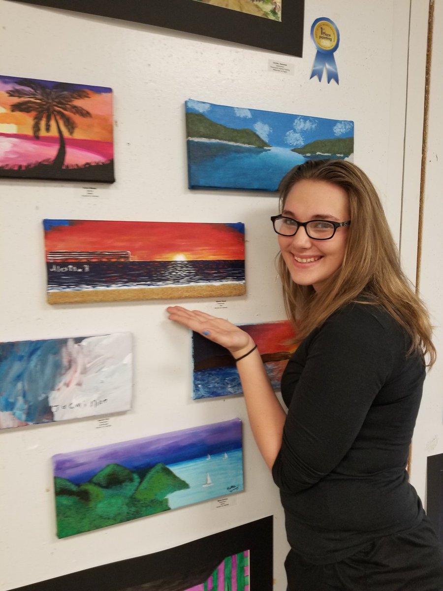 LHS210Wing's tweet photo. LHS Fine Arts student Alexis Hood with her landscape at the LHS Gallery 306 Art is the Word show. #GoLemont #LemontArt https://t.co/va8LwTKE79