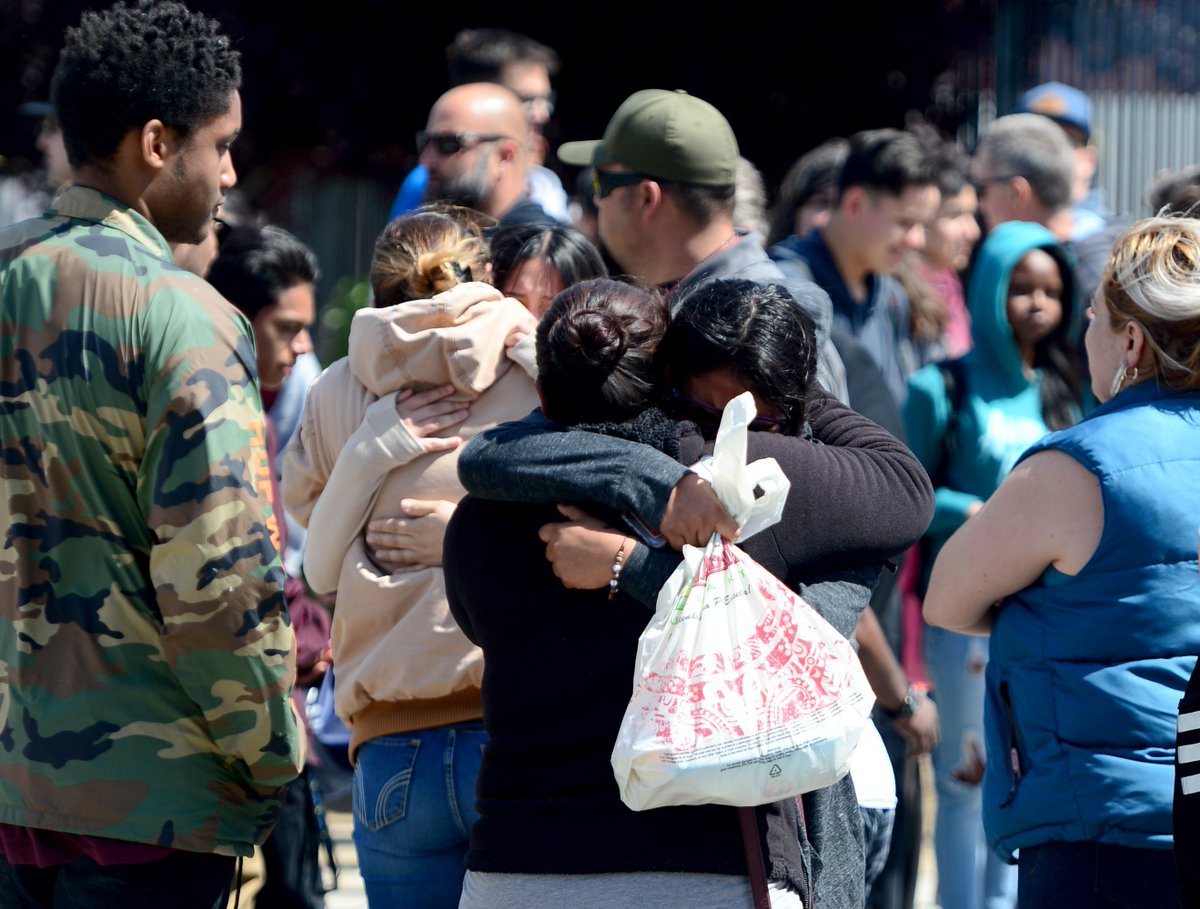 deanmusgrove's tweet photo. Families reunited after #HighlandHigh #shooting in #Palmdale https://t.co/hWtr9u791D