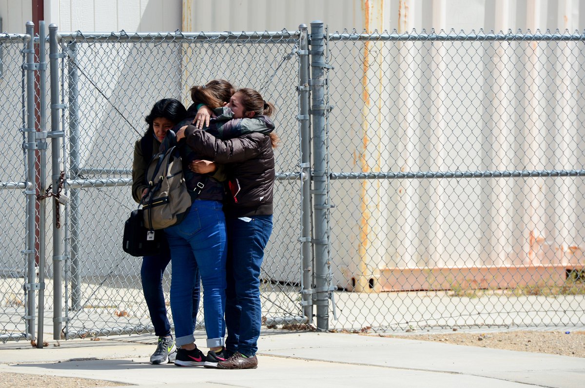 deanmusgrove's tweet photo. Families reunited after #HighlandHigh #shooting in #Palmdale https://t.co/hWtr9u791D