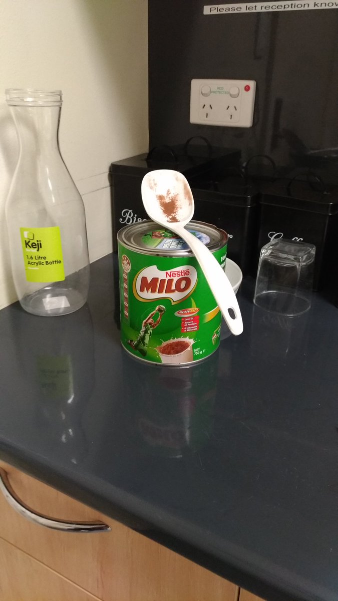 me_boyo's tweet photo. Spotted in the #workkitchen. Think someone is having a rough day - hope you're ok!  [Note: that is a 750g @MILOausnz tin and a salad spoon] https://t.co/Ov1e1OTcom