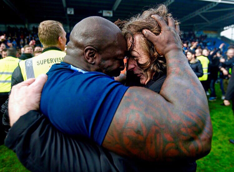 dannykellywords's tweet photo. That promotion feeling. Gareth Ainsworth's hair, @daRealAkinfenwa's arm, and the sports photograph of the year. https://t.co/Q6Zv1RrKOe